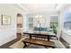 Bright dining room features a chandelier, large windows, and stylish decor at 1004 Princesa Dr, Matthews, NC 28104