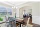 Spacious dining room with tray ceilings, large windows, and stylish decor at 1004 Princesa Dr, Matthews, NC 28104