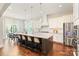 Large kitchen island with granite countertops and a breakfast bar with seating at 1004 Princesa Dr, Matthews, NC 28104