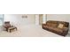 Spacious living room with a comfortable sofa, chair, and ample natural light, perfect for relaxation at 1004 Princesa Dr, Matthews, NC 28104