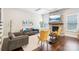 Inviting living room with a stone fireplace, hardwood floors, and comfortable seating at 1004 Princesa Dr, Matthews, NC 28104