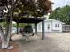 Exterior view of lake home with covered boat parking and scenic surroundings at 101 Dogwood Cir, New London, NC 28127