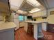Bright kitchen with lots of cabinet space, island, and a view outside the window at 101 Dogwood Cir, New London, NC 28127
