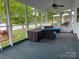 A lake view from the outdoor patio with cozy outdoor furniture at 101 Dogwood Cir, New London, NC 28127