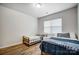Bright bedroom with two twin beds, wood floors and a window letting in natural light at 1150 Hearth Sw Ln, Concord, NC 28025