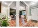Spacious home office featuring custom built-in shelving, hardwood floors, and large windows at 1150 Hearth Sw Ln, Concord, NC 28025