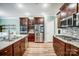 Well-equipped kitchen featuring stainless steel appliances, hardwood floors, and ample counter space at 1150 Hearth Sw Ln, Concord, NC 28025