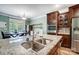 Gourmet kitchen showcasing granite countertops, stainless steel sink, and modern appliances, perfect for culinary enthusiasts at 1150 Hearth Sw Ln, Concord, NC 28025