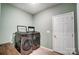 Modern laundry room featuring new front-load washer and dryer and a wooden countertop at 1150 Hearth Sw Ln, Concord, NC 28025