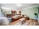 Open concept living area seamlessly connects to the kitchen and dining with stylish furniture at 1150 Hearth Sw Ln, Concord, NC 28025
