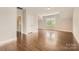 Spacious bedroom featuring hardwood floors, neutral walls, and natural light from windows at 117 Fellspoint Rd, Mooresville, NC 28115