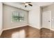 This bedroom features hardwood floors, natural light, and a modern ceiling fan at 117 Fellspoint Rd, Mooresville, NC 28115