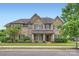 Charming brick home featuring a well-manicured lawn and traditional design elements under a clear blue sky at 117 Fellspoint Rd, Mooresville, NC 28115