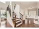 Elegant foyer with hardwood floors, staircase and light filled entrance at 117 Fellspoint Rd, Mooresville, NC 28115