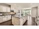 Gourmet kitchen featuring granite countertops, a large center island, and a cozy breakfast nook at 117 Fellspoint Rd, Mooresville, NC 28115