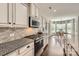 This spacious kitchen features granite countertops, stainless steel appliances, and ample storage at 117 Fellspoint Rd, Mooresville, NC 28115
