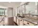 Modern kitchen boasts granite countertops, stainless steel sink, and sleek appliances at 117 Fellspoint Rd, Mooresville, NC 28115