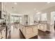 Bright kitchen with stainless steel appliances, a large center island, and an adjacent breakfast nook at 117 Fellspoint Rd, Mooresville, NC 28115