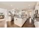 Gourmet kitchen with granite countertops, a large center island, stainless steel appliances, and dark hardwood floors at 117 Fellspoint Rd, Mooresville, NC 28115