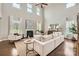 Bright living room featuring high ceilings, a fireplace, and elegant decor, perfect for relaxation at 117 Fellspoint Rd, Mooresville, NC 28115