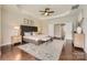 Spacious main bedroom with tray ceiling, natural light, and hardwood floors at 117 Fellspoint Rd, Mooresville, NC 28115