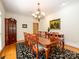 Formal dining room with a chandelier, large table, and classic decor at 1209 S South St, Gastonia, NC 28052