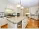 Open kitchen featuring stainless steel appliances, granite countertops and an island with seating at 1209 S South St, Gastonia, NC 28052