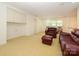 Upstairs living room with built-in shelving and comfortable furniture at 1209 S South St, Gastonia, NC 28052