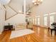 Open-concept living room with hardwood floors and access to the upper level at 1209 S South St, Gastonia, NC 28052