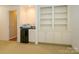 Cozy living space with a kitchenette and custom built-in shelving for storage and display at 1209 S South St, Gastonia, NC 28052