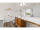Well-lit bathroom with a long vanity, updated fixtures, and accessible features at 124 Shephard Hill Dr, Mooresville, NC 28115