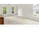 Bright, carpeted bedroom with ample natural light and neutral walls, creating a serene space at 124 Shephard Hill Dr, Mooresville, NC 28115