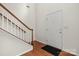 Inviting foyer with hardwood flooring, a staircase with wood railing, and a welcoming entrance at 124 Shephard Hill Dr, Mooresville, NC 28115