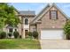 Charming brick home with a well-manicured lawn and attached two-car garage, perfect for families at 124 Shephard Hill Dr, Mooresville, NC 28115