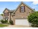 Traditional two-story home with brick facade, well maintained lawn and attached two car garage at 124 Shephard Hill Dr, Mooresville, NC 28115