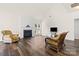 Bright living room features a fireplace and large windows for natural light at 124 Shephard Hill Dr, Mooresville, NC 28115