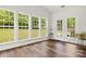 Sun room features walls of windows and access to the backyard at 124 Shephard Hill Dr, Mooresville, NC 28115