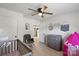 Cozy Bedroom featuring gray wood-look floors, natural lighting, and a gray crib at 135 Mcshag Dr, Kannapolis, NC 28081
