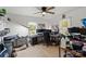 A cluttered room that can be converted to bedroom with windows and ceiling fan at 135 Mcshag Dr, Kannapolis, NC 28081