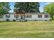 Charming ranch home featuring a covered front porch and spacious front yard at 135 Mcshag Dr, Kannapolis, NC 28081
