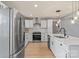 Bright kitchen features stainless steel appliances, white cabinets and wooden floors at 135 Mcshag Dr, Kannapolis, NC 28081