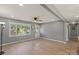 Bright living room with fresh paint, hardwood floors, and a ceiling fan at 135 Mcshag Dr, Kannapolis, NC 28081