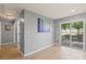 A cozy, freshly painted room with hardwood floors and access to the backyard at 135 Mcshag Dr, Kannapolis, NC 28081