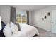 This bedroom has natural light, gray carpet, curtains and white walls at 136 Meadow View Dr, Statesville, NC 28677