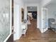 Inviting foyer with hardwood floors, console table, and view of the living room and staircase at 136 Meadow View Dr, Statesville, NC 28677