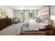 Spacious bedroom showcasing two large windows, a plush bed, and stylish decor at 138 Meadow View Dr, Statesville, NC 28677