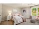 Bright bedroom with plush carpet, a large window, and neutral-toned walls creating a cozy atmosphere at 138 Meadow View Dr, Statesville, NC 28677