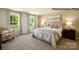 Spacious bedroom showcasing two large windows, a plush bed, and stylish decor at 138 Meadow View Dr, Statesville, NC 28677