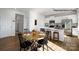 Open dining area featuring a round table with seating for six, and seamlessly connected to the kitchen at 138 Meadow View Dr, Statesville, NC 28677