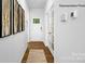 Inviting entryway boasting wood floors, leading to a bright space with natural light and stylish decor at 138 Meadow View Dr, Statesville, NC 28677